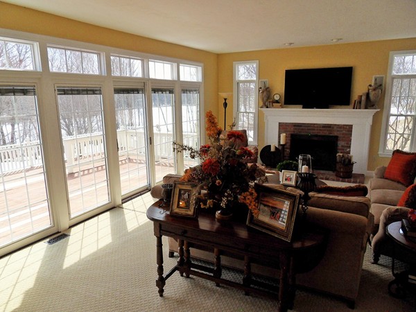 3 Clarks Hill Drive Sutton, MA 01590 - Photo 17 of 30 a living room with furniture a flat screen tv and a fireplace