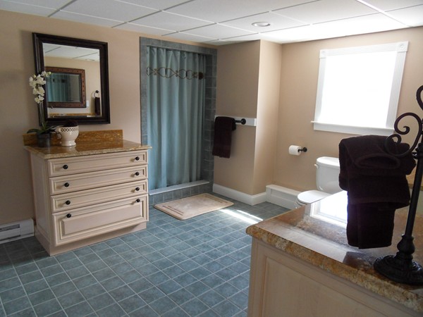 3 Clarks Hill Drive Sutton, MA 01590 - Photo 29 of 30 a bathroom with a granite countertop sink a vanity and a mirror