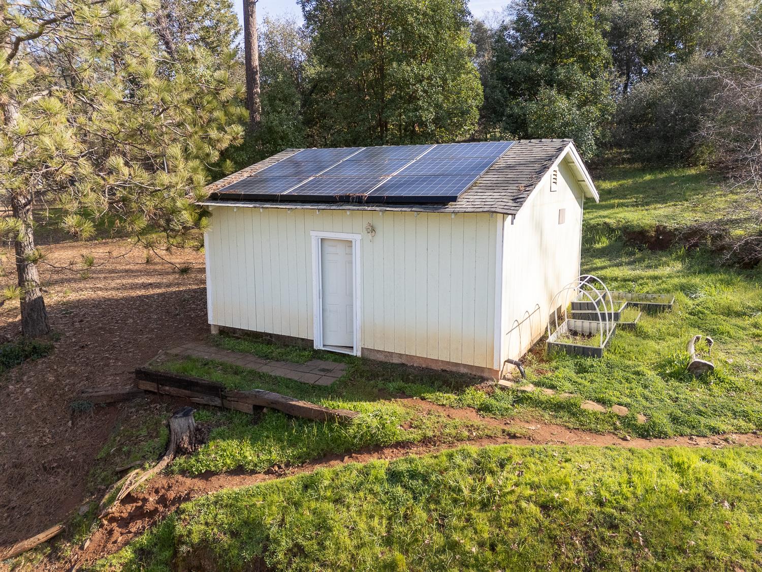 10146 Frenchtown Dobbins Road Dobbins, CA 95935 - Photo 22 of 38 a aerial view of a house with yard and trees in the background