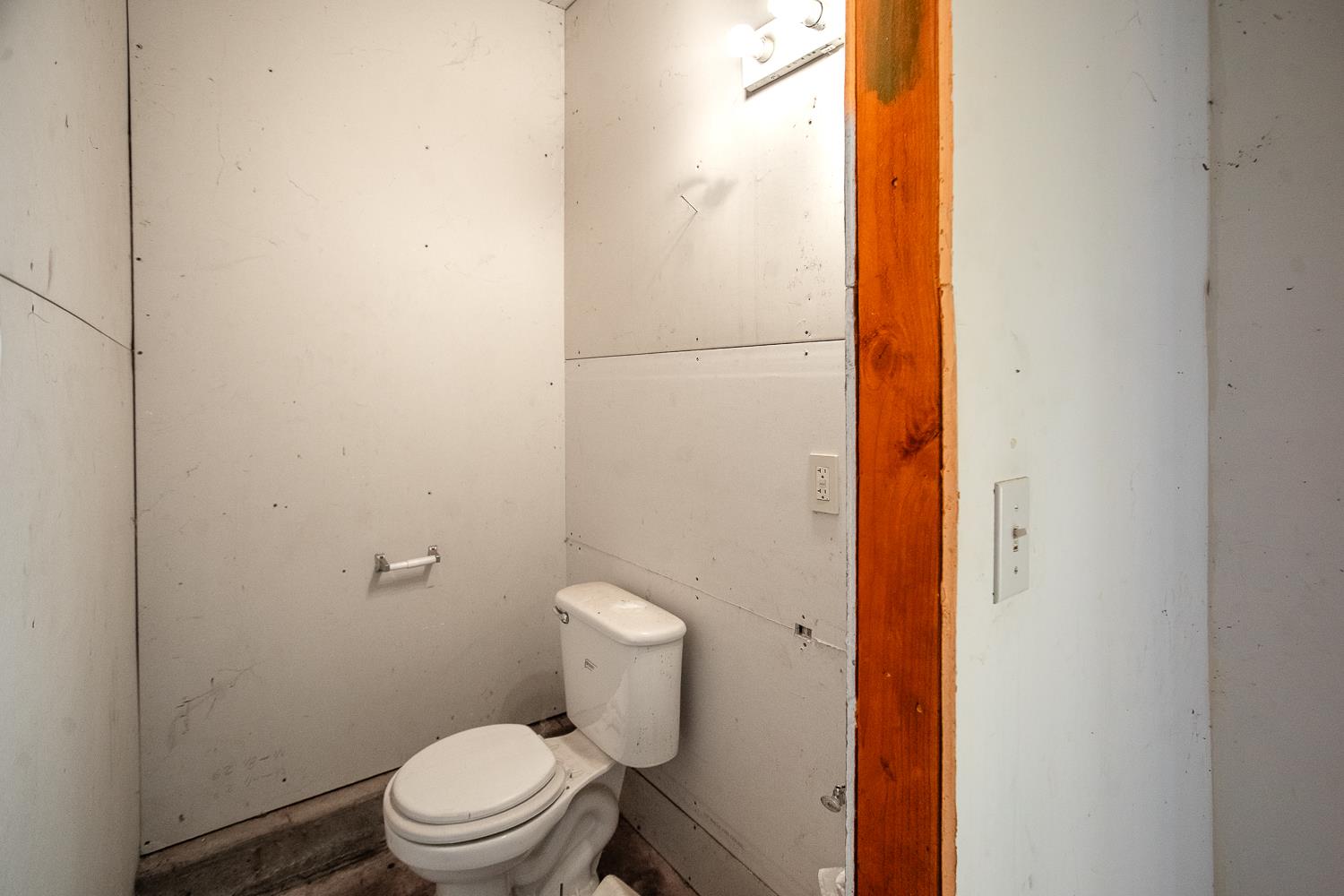 10146 Frenchtown Dobbins Road Dobbins, CA 95935 - Photo 25 of 38 a white toilet sitting next to a shower