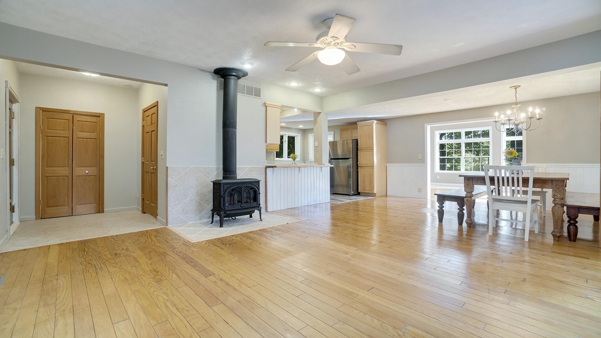 11501 Love Road Roscoe, IL 61073 - Photo 12 of 49 a view of a livingroom with furniture hardwood floor and a ceiling fan
