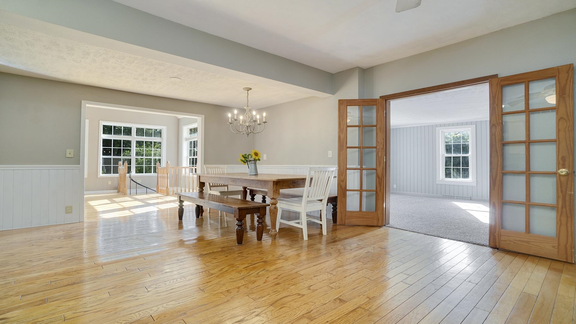 11501 Love Road Roscoe, IL 61073 - Photo 15 of 49 a view of a dining room with furniture and wooden floor