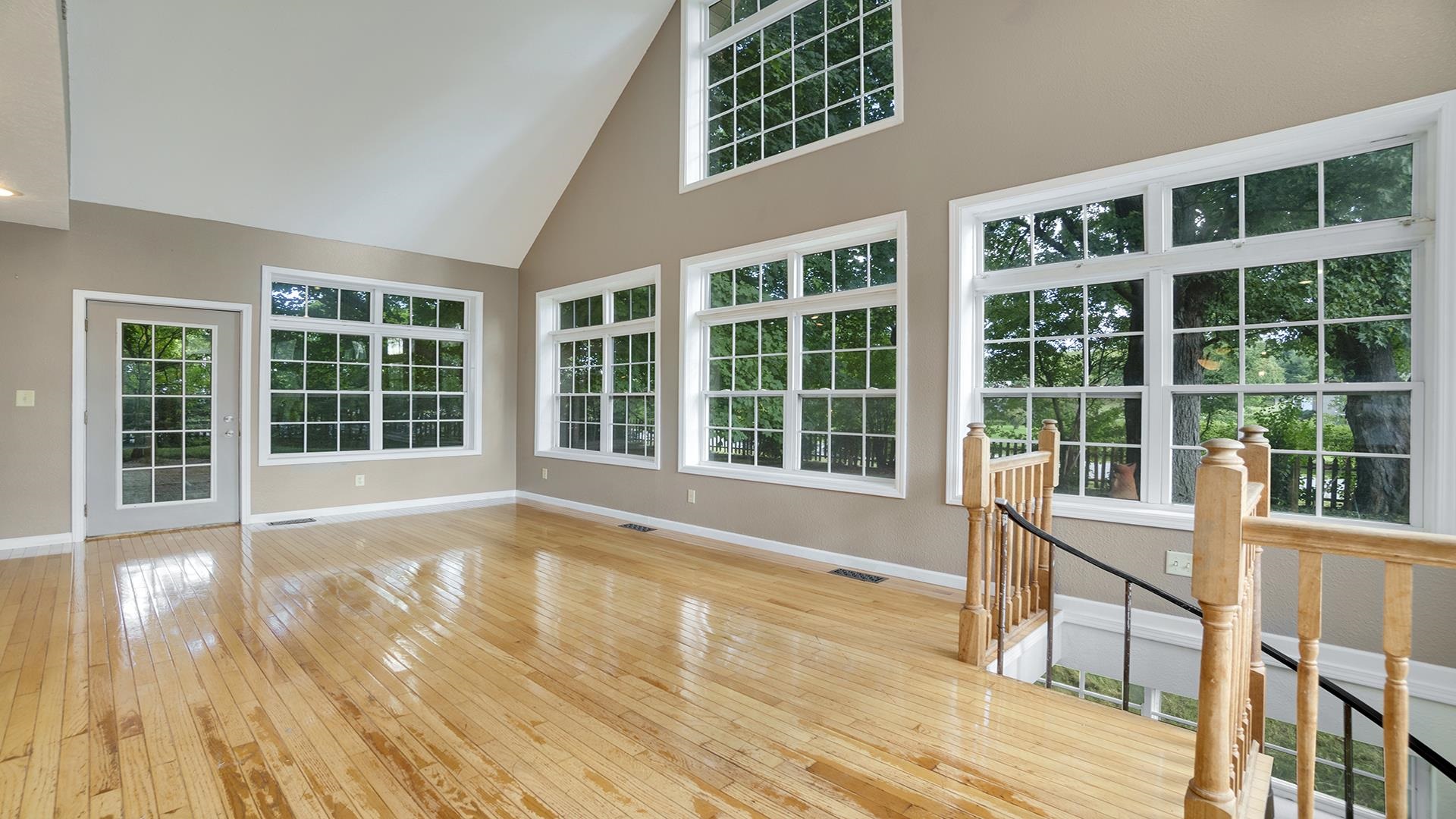 11501 Love Road Roscoe, IL 61073 - Photo 21 of 49 a view of a large window with wooden floor and fence