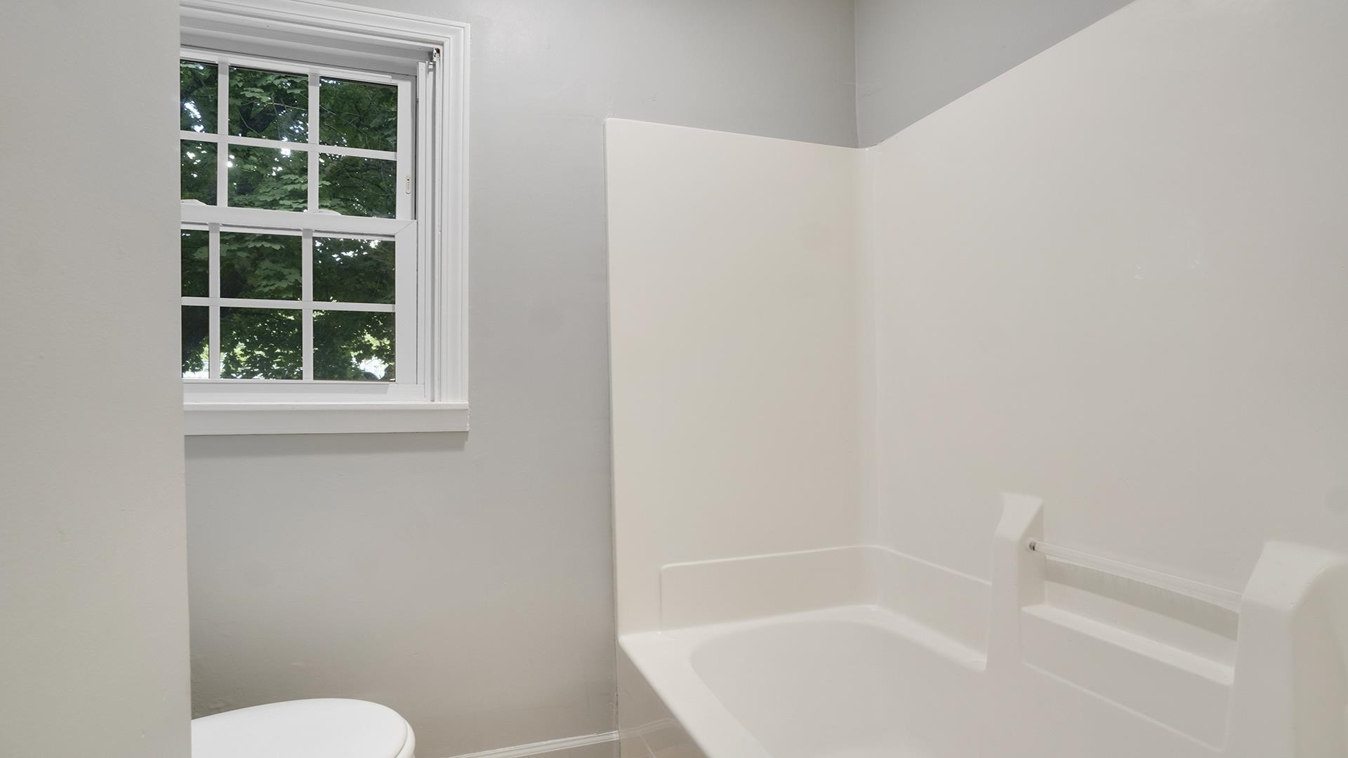 11501 Love Road Roscoe, IL 61073 - Photo 24 of 49 a white bath tub sitting next to a window