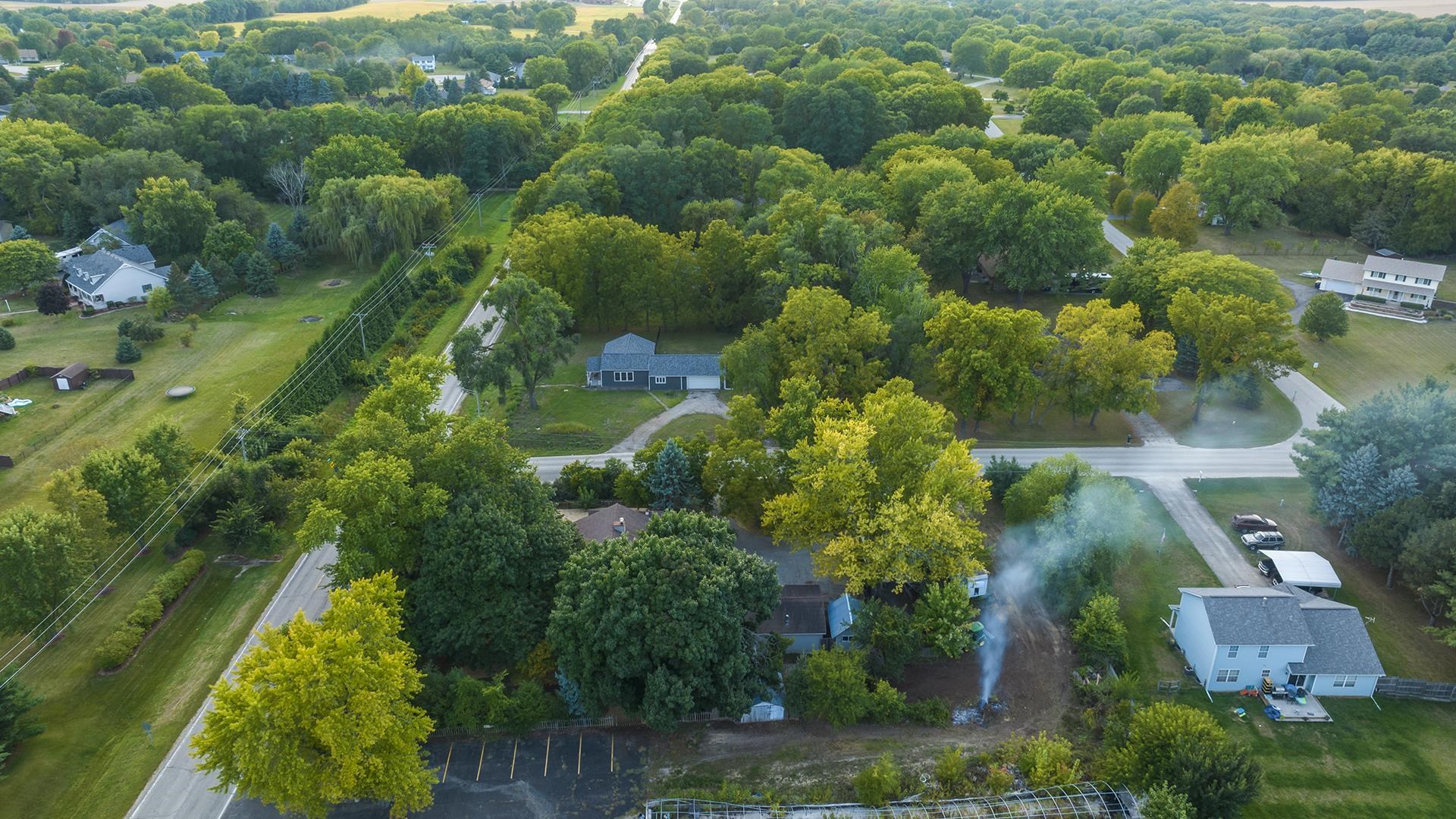 11501 Love Road Roscoe, IL 61073 - Photo 6 of 49 an aerial view of residential house with outdoor space and trees all around