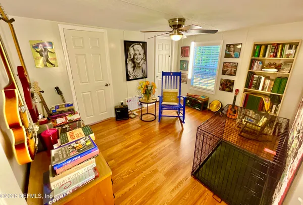 a view of an entryway with wooden floor