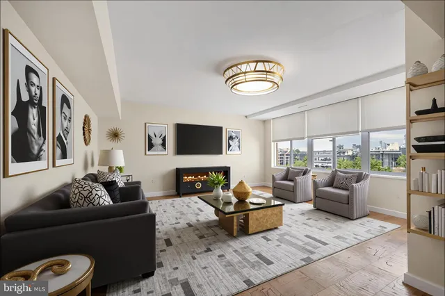 a living room with furniture fireplace and a flat screen tv