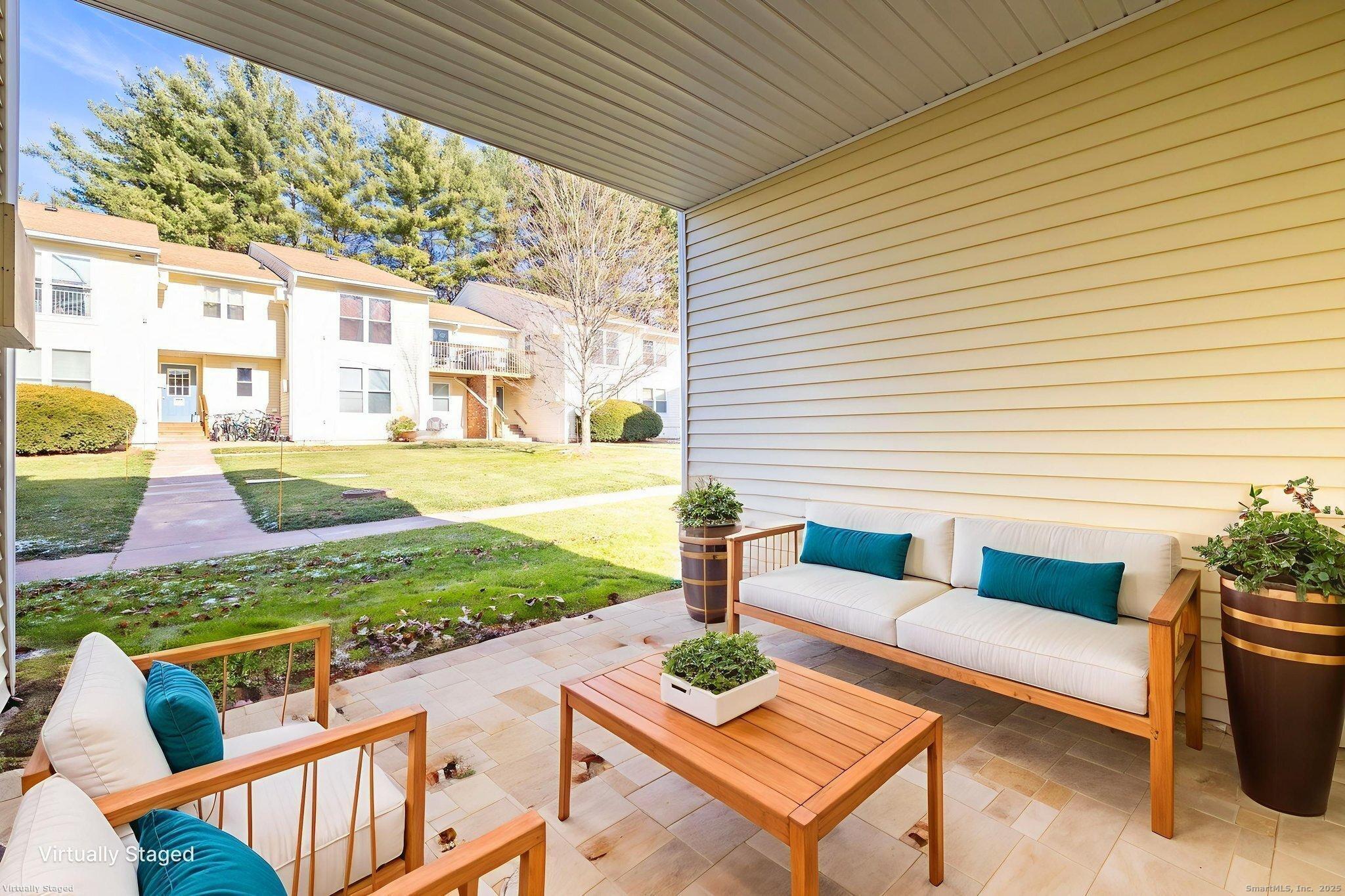 949 Pleasant Valley Road, Unit 801 South Windsor, CT 06074 - Photo 13 of 22 a building outdoor space with patio furniture