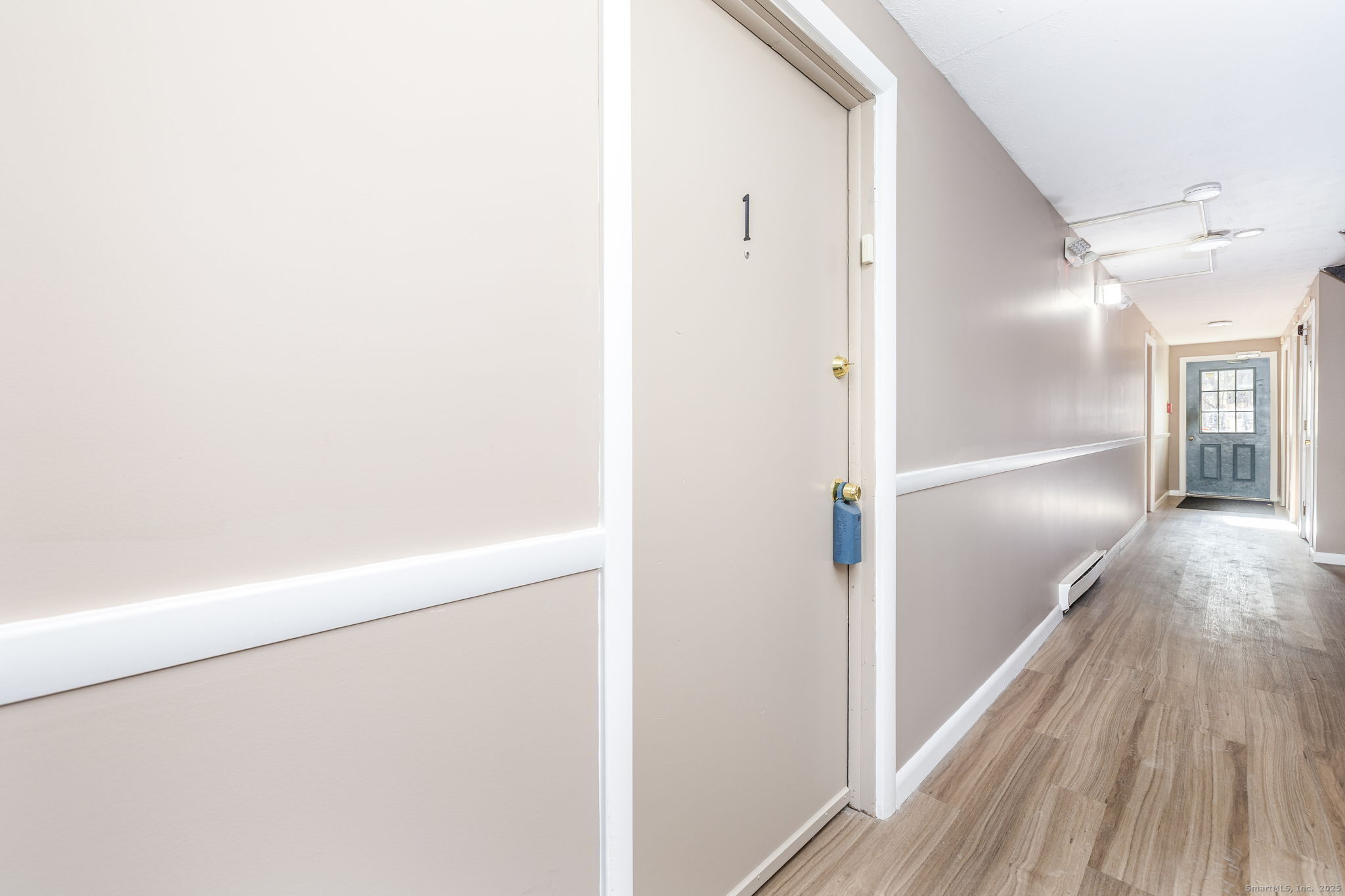 949 Pleasant Valley Road, Unit 801 South Windsor, CT 06074 - Photo 16 of 22 a view of a hallway with wooden floor