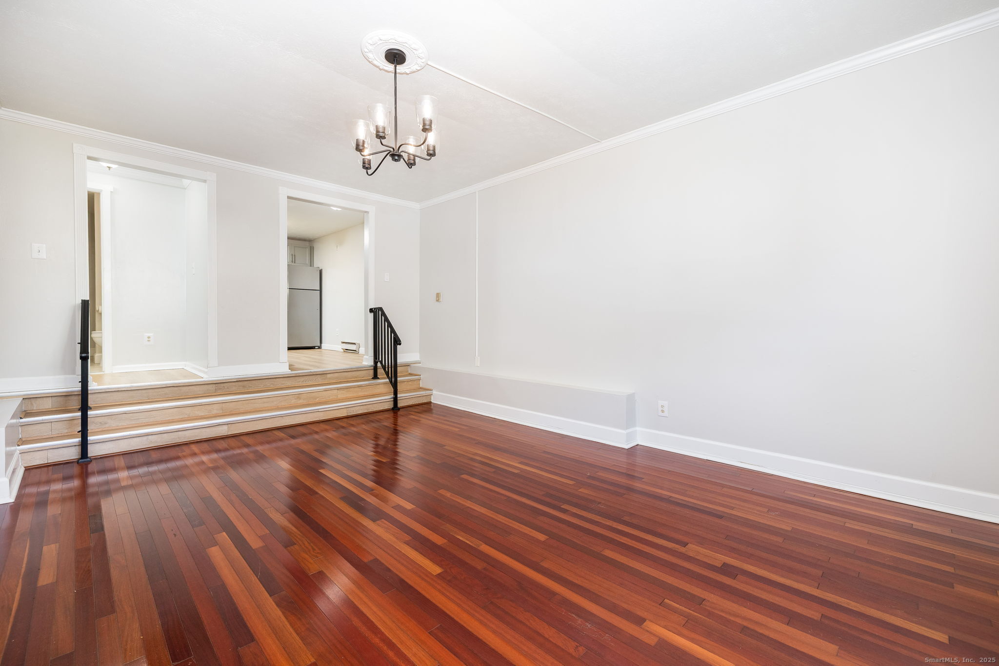 949 Pleasant Valley Road, Unit 801 South Windsor, CT 06074 - Photo 6 of 22 a view of a livingroom with wooden floor and a ceiling fan