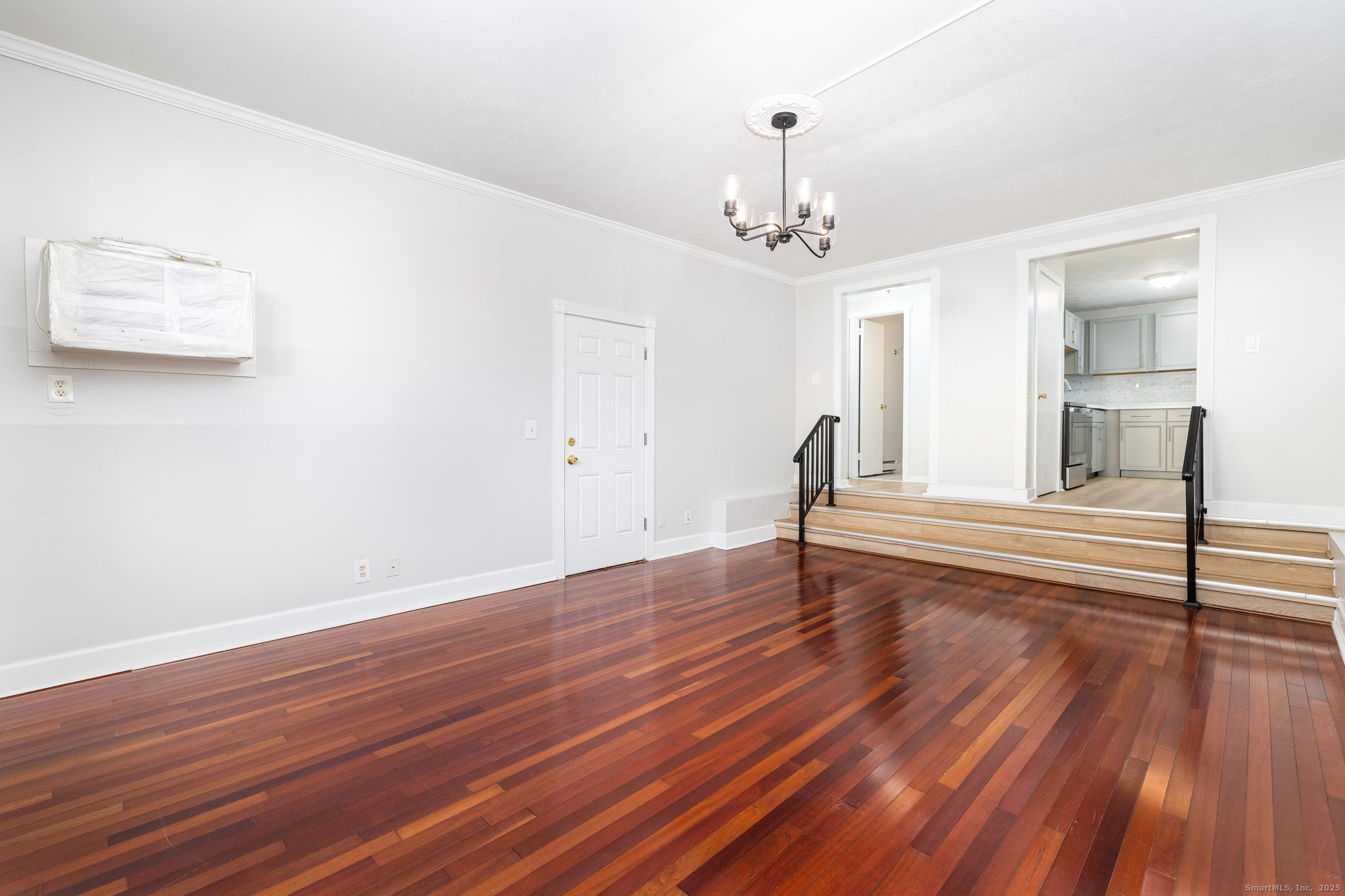 949 Pleasant Valley Road, Unit 801 South Windsor, CT 06074 - Photo 7 of 22 a view of a room with wooden floor and ceiling window