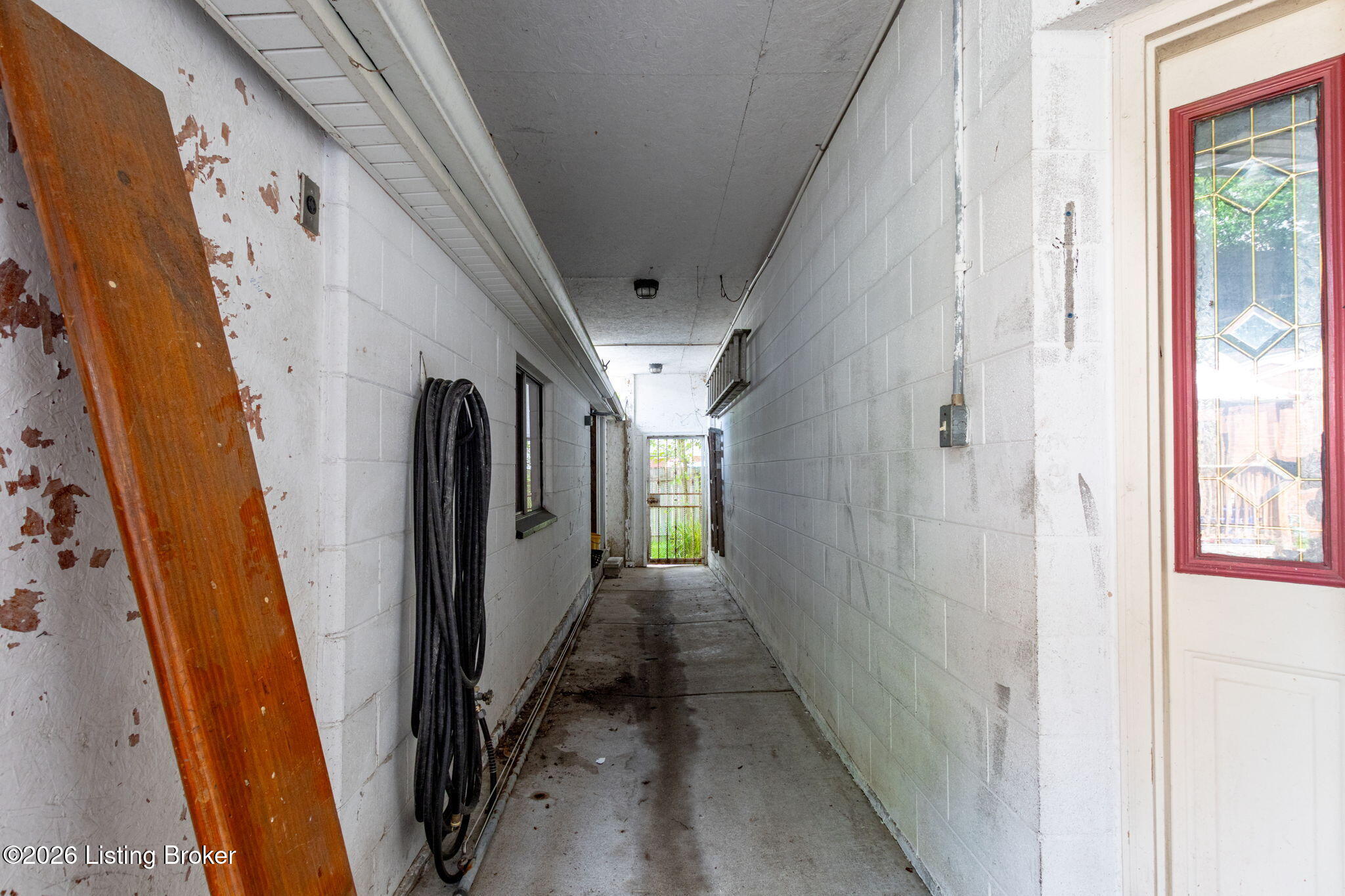 311 Meadowood Road Louisville, KY 40229 - Photo 14 of 42 Hall in between the ADU and the garage/meeting room