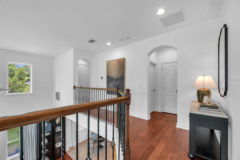 5310 Fishhawk Ridge Drive Lithia, FL 33547 - Photo 33 of 52 a view of a hallway with wooden floor windows and a livingroom