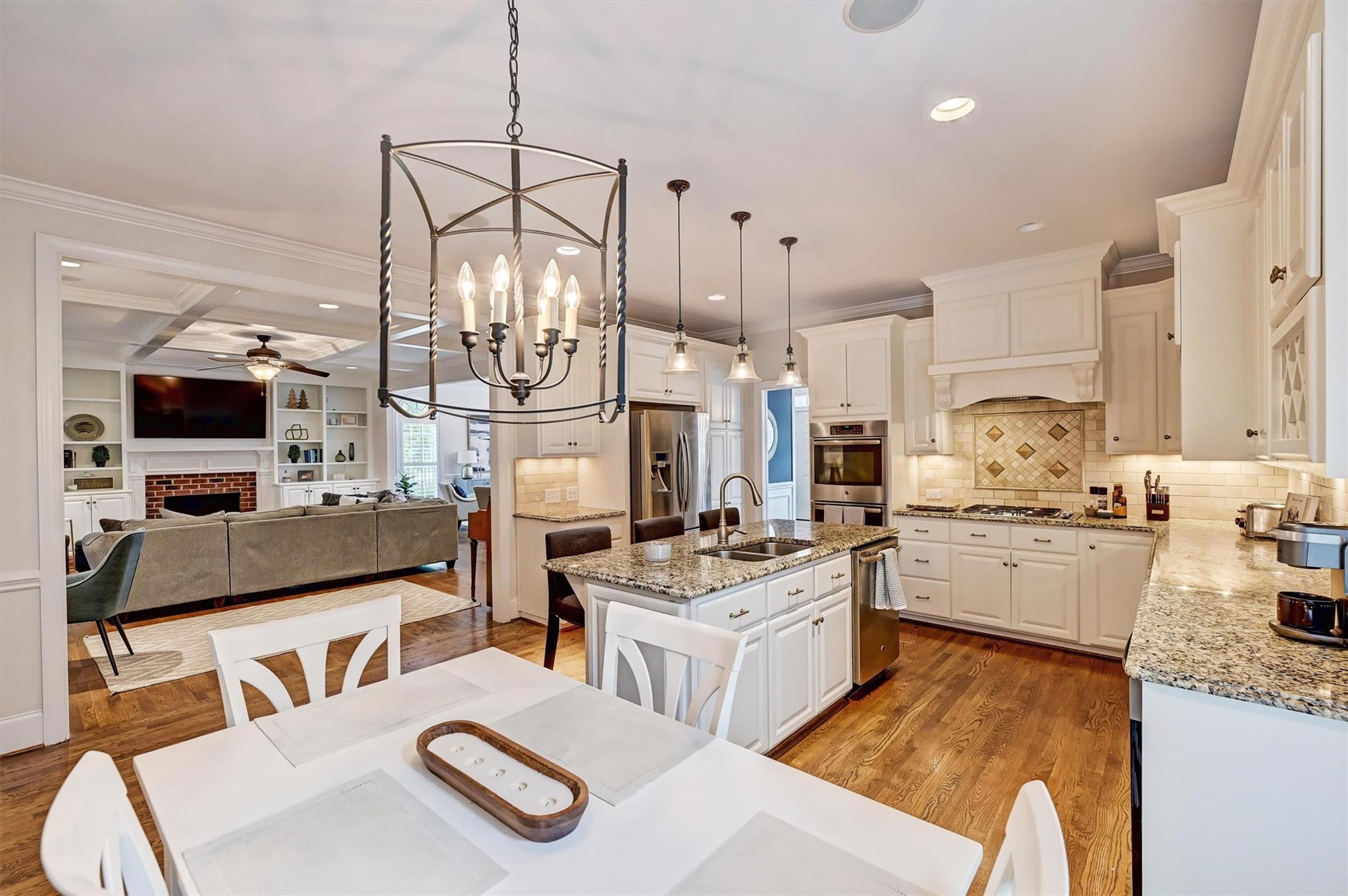 6009 Sharon View Road Charlotte, NC 28226 - Photo 17 of 47 a kitchen with a stove a sink and a refrigerator