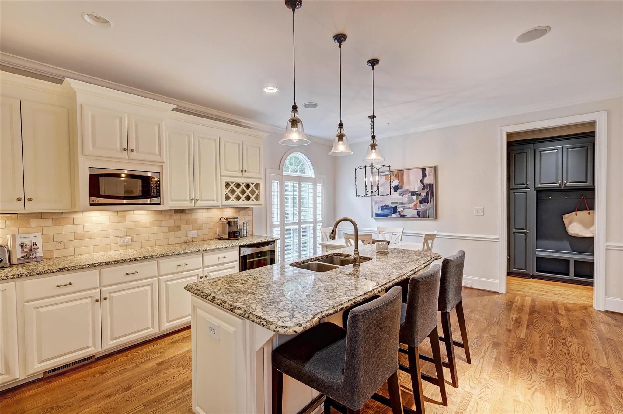 6009 Sharon View Road Charlotte, NC 28226 - Photo 20 of 47 a kitchen with stainless steel appliances granite countertop a kitchen island a stove a table and chairs
