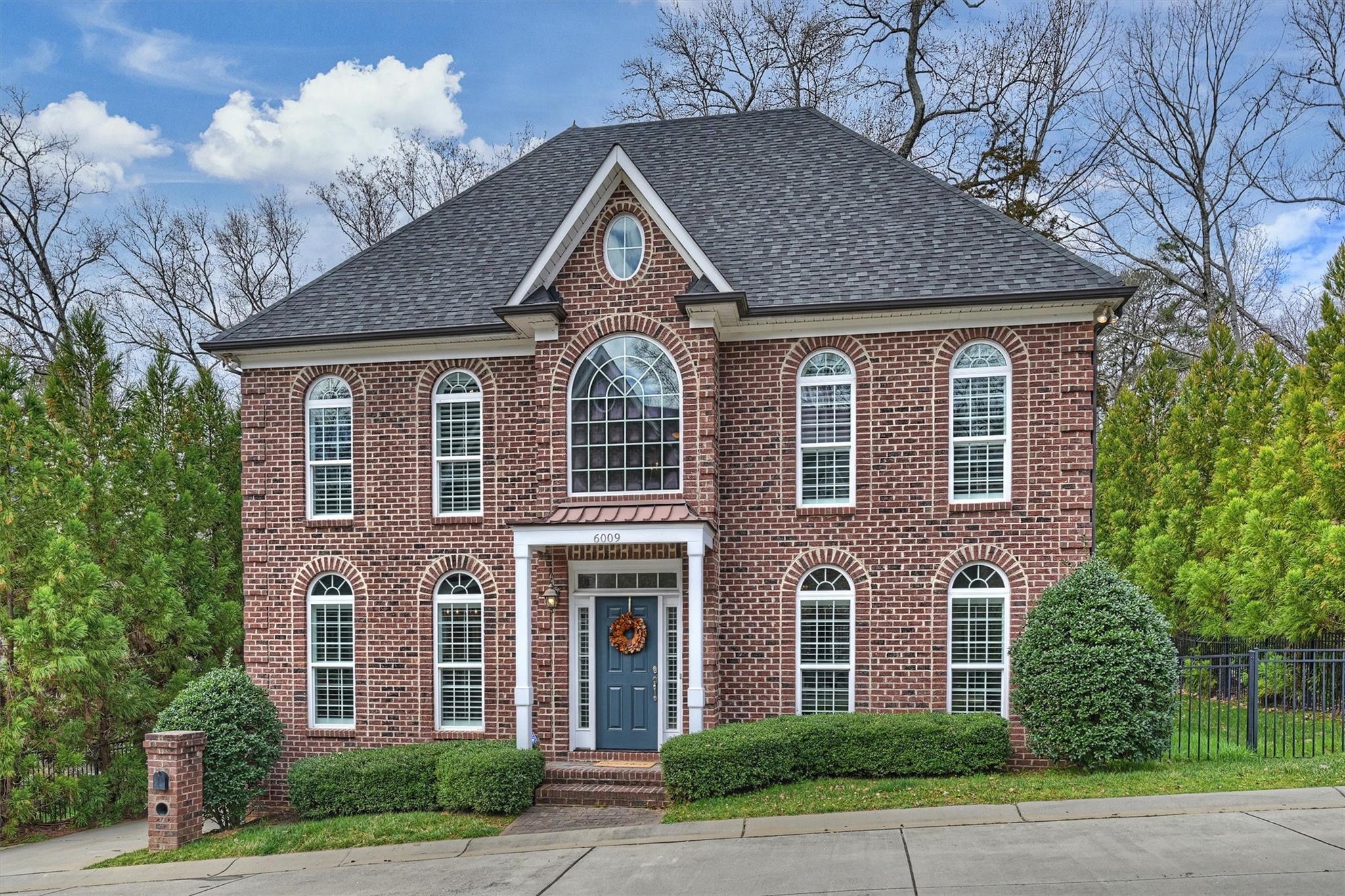 6009 Sharon View Road Charlotte, NC 28226 - Photo 2 of 47 a front view of a house with garden