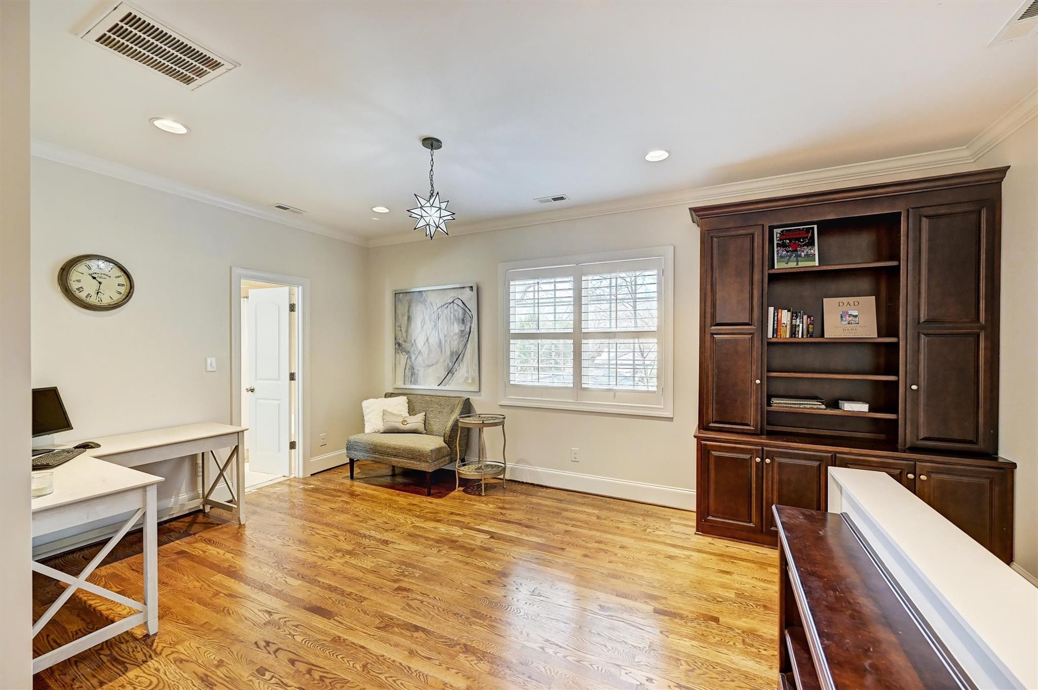6009 Sharon View Road Charlotte, NC 28226 - Photo 24 of 47 a living room with furniture and a flat screen tv