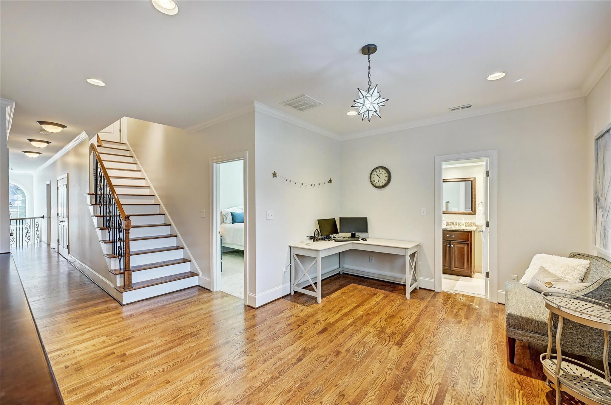 6009 Sharon View Road Charlotte, NC 28226 - Photo 26 of 47 a view of a livingroom with wooden floor and staircase