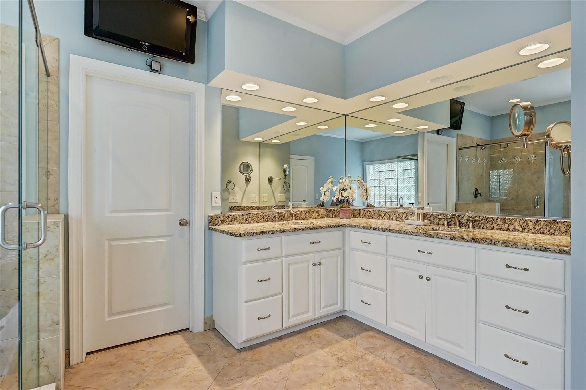 6009 Sharon View Road Charlotte, NC 28226 - Photo 30 of 47 a bathroom with a granite countertop sink two mirror and a