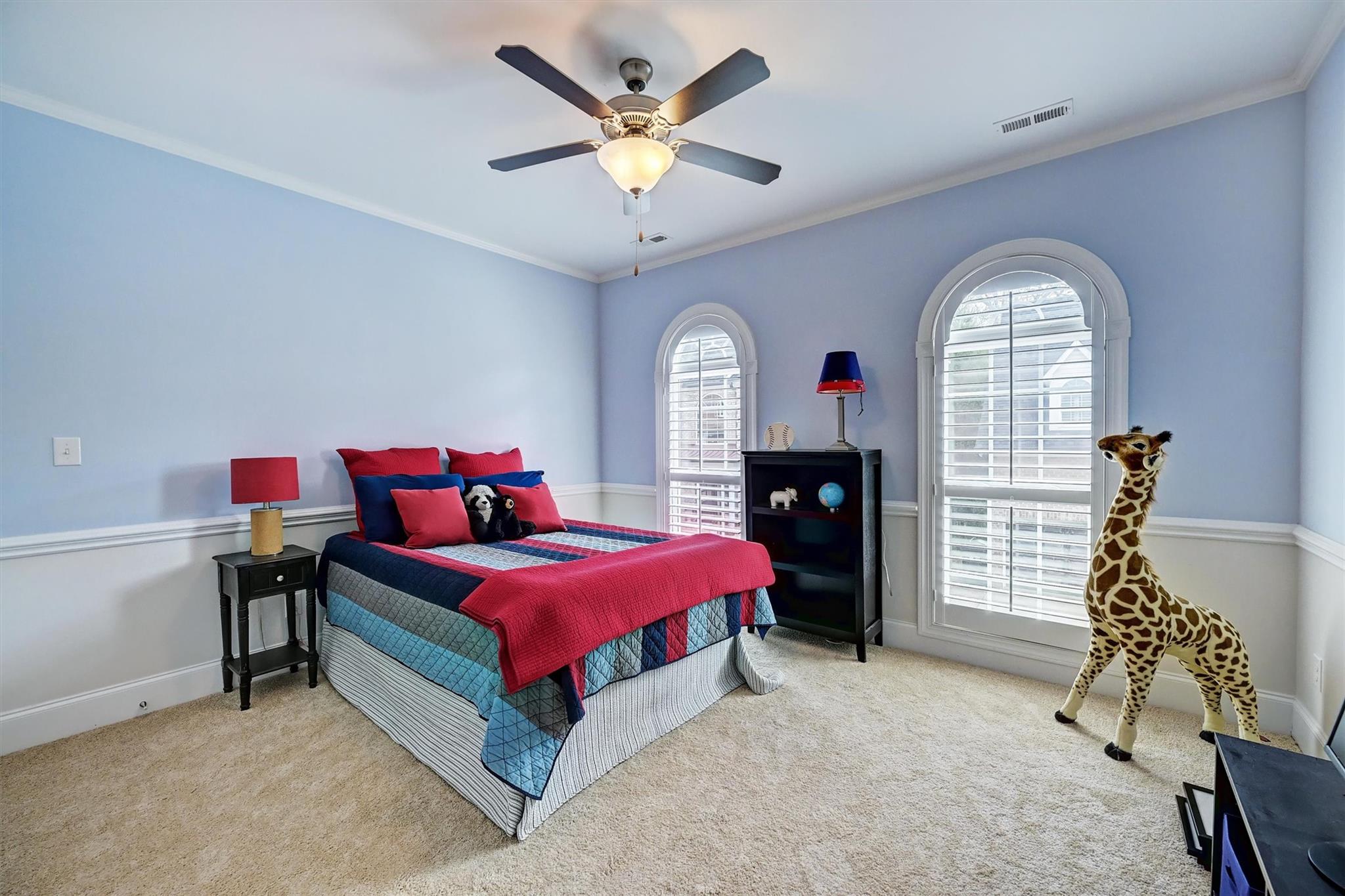 6009 Sharon View Road Charlotte, NC 28226 - Photo 33 of 47 a bedroom with a bed and a chandelier