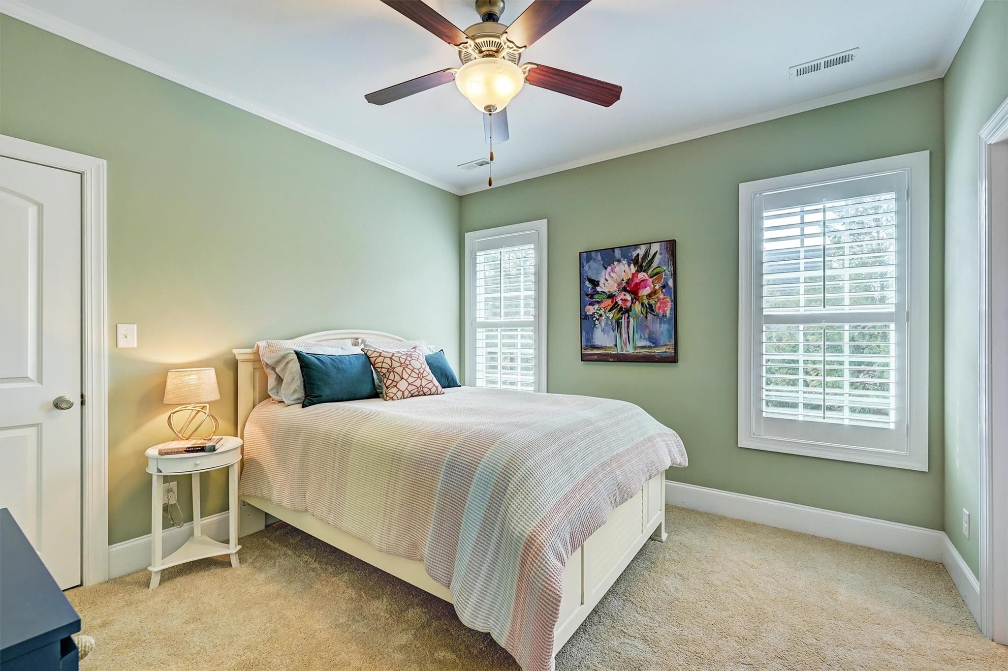 6009 Sharon View Road Charlotte, NC 28226 - Photo 34 of 47 a bedroom with a bed and a chandelier