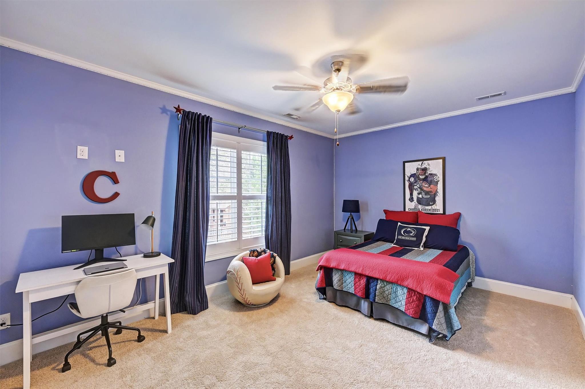 6009 Sharon View Road Charlotte, NC 28226 - Photo 36 of 47 a bedroom with a bed and a chandelier