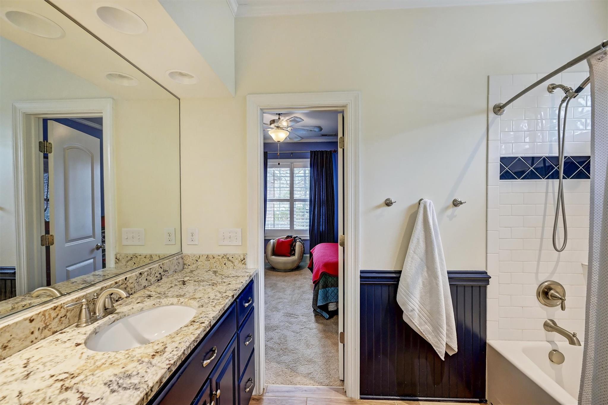 6009 Sharon View Road Charlotte, NC 28226 - Photo 37 of 47 a bathroom with a granite countertop sink and a mirror