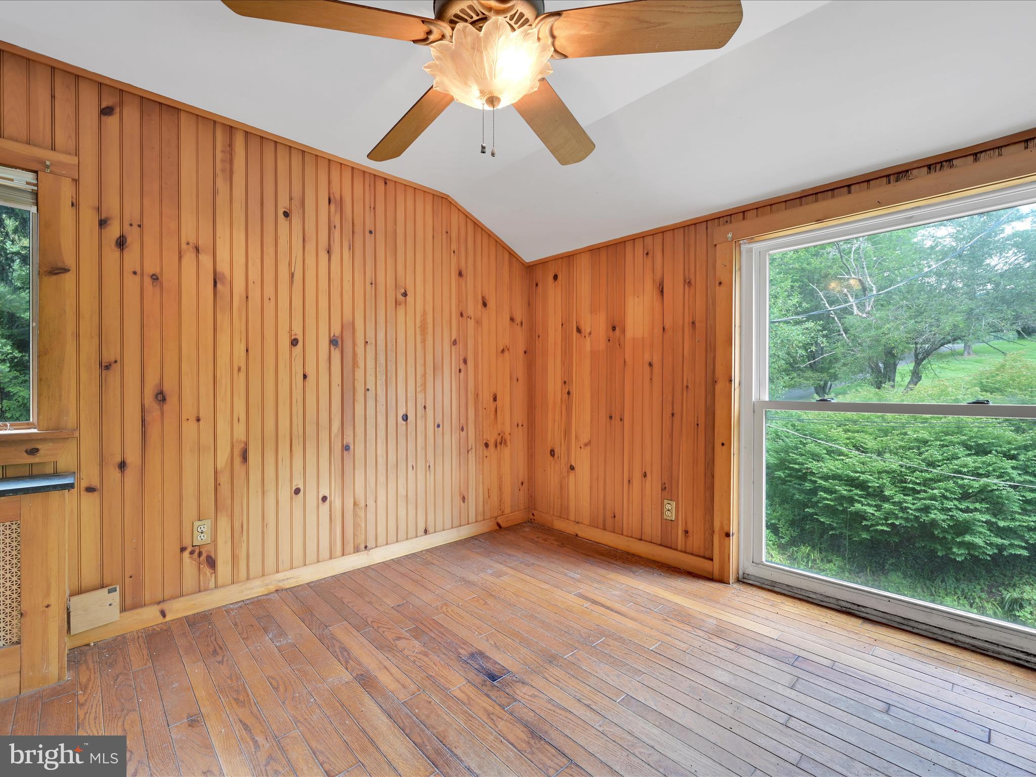 21 Blue Rocks Road Lenhartsville, PA 19534 - Photo 25 of 48 an empty room with wooden floor and windows