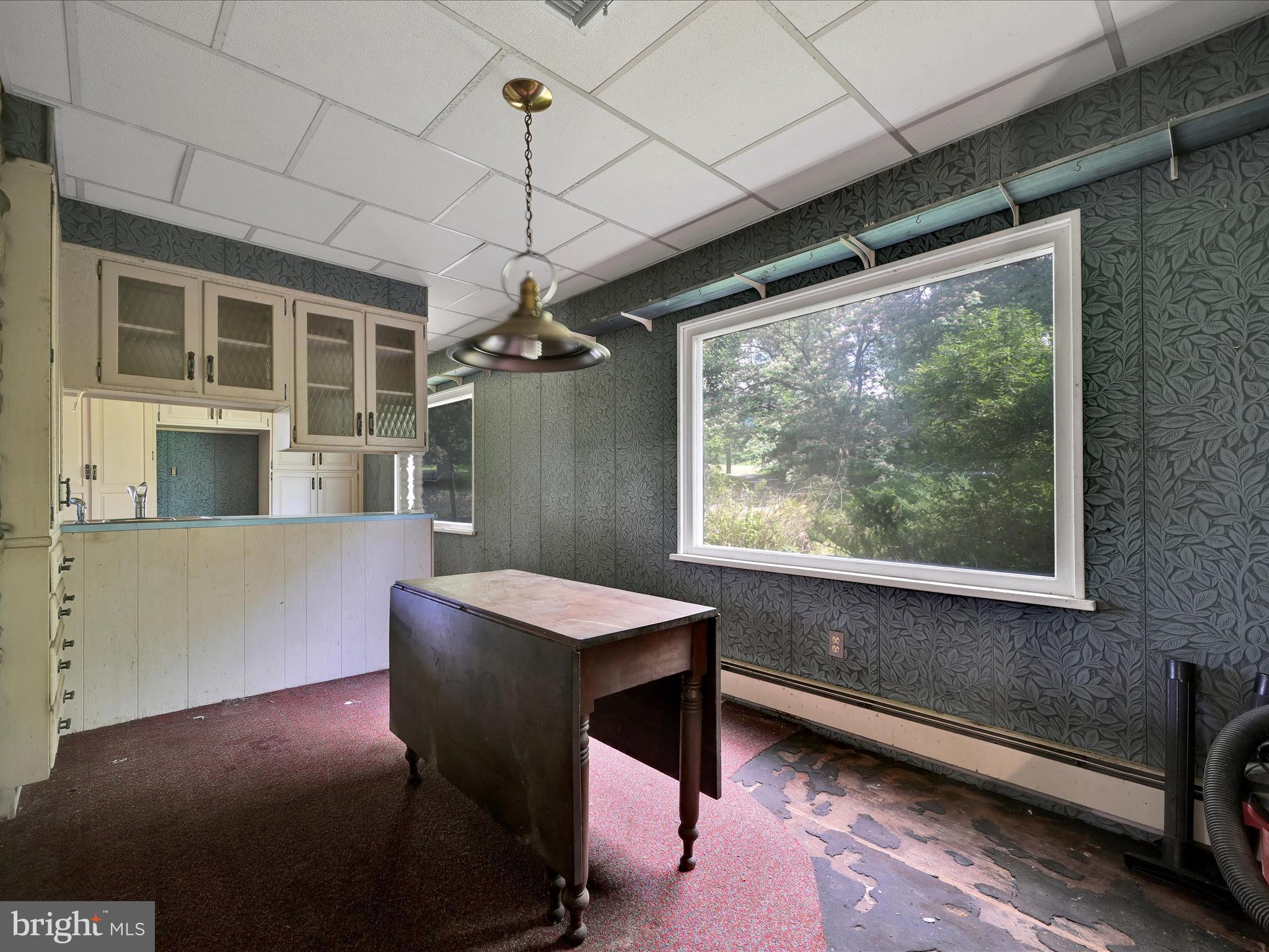 21 Blue Rocks Road Lenhartsville, PA 19534 - Photo 9 of 48 a dining room with a large window and table