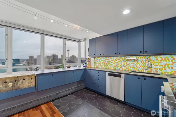 a kitchen with sink and cabinets