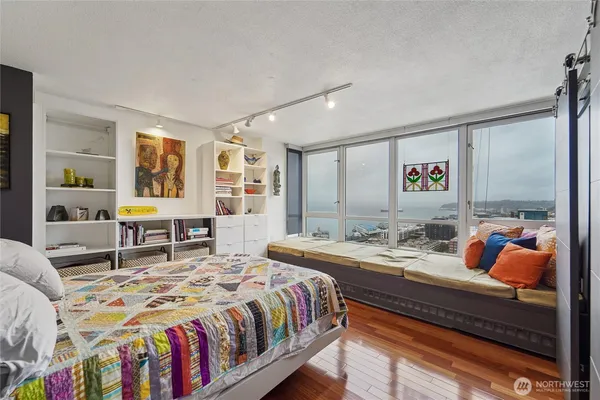 a bedroom with a bed and window