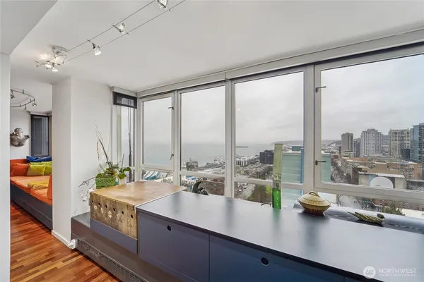 a view of a living room and kitchen