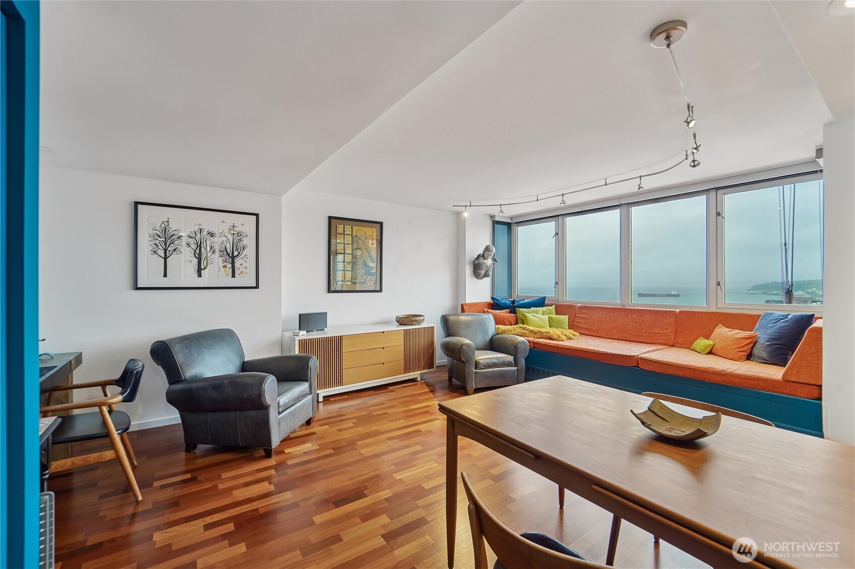 2125 1st Avenue, Unit 1702 Seattle, WA 98121 - Photo 7 of 26 a living room with furniture and a wooden floor