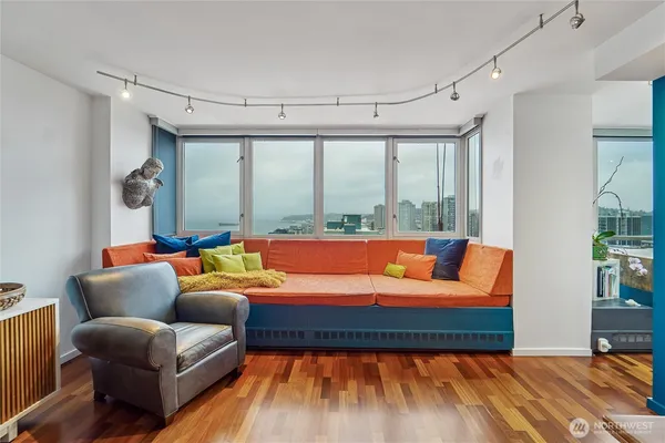 a living room with large window and a couch