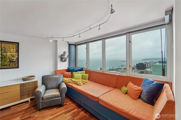 a living room with furniture and a large window