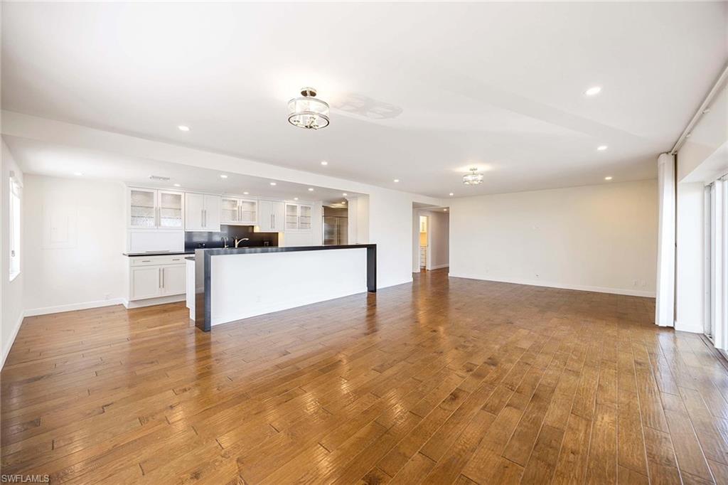 1325 7th Street South, Unit 2B Naples, FL 34102 - Photo 11 of 34 a view of kitchen with kitchen island refrigerator stove and cabinets