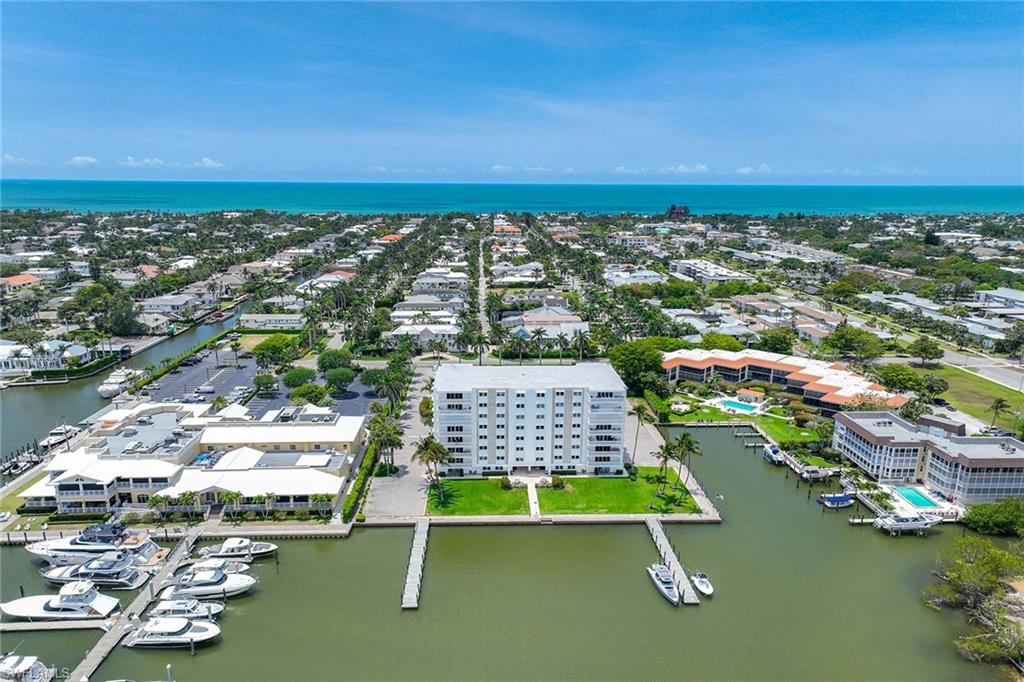 1325 7th Street South, Unit 2B Naples, FL 34102 - Photo 2 of 34 an aerial view of residential houses with outdoor space