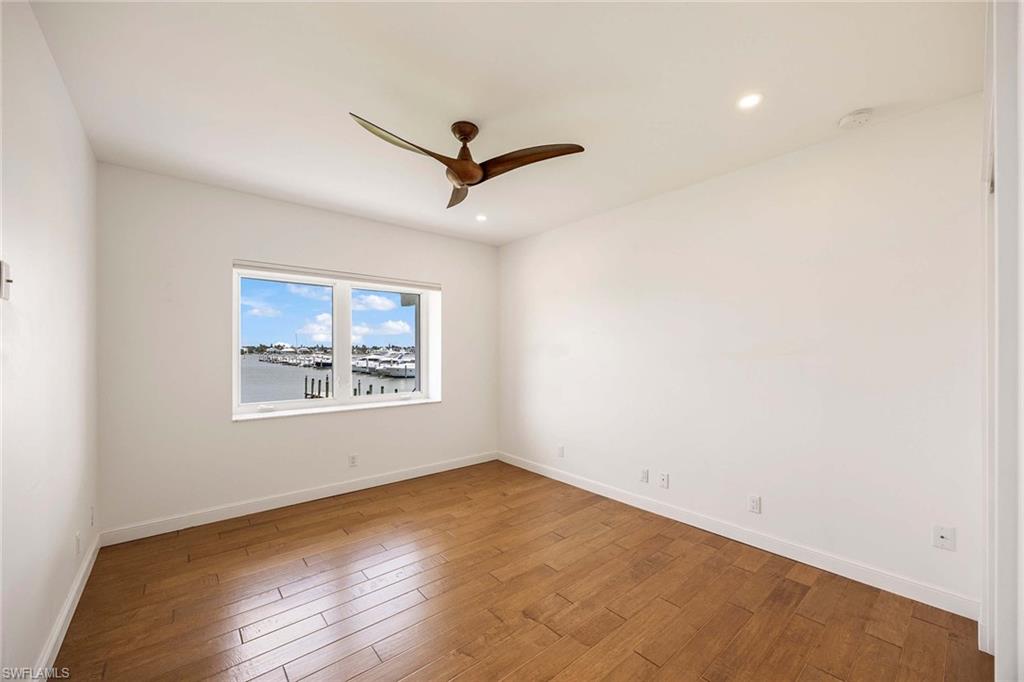1325 7th Street South, Unit 2B Naples, FL 34102 - Photo 21 of 34 a view of a big room with wooden floor and windows
