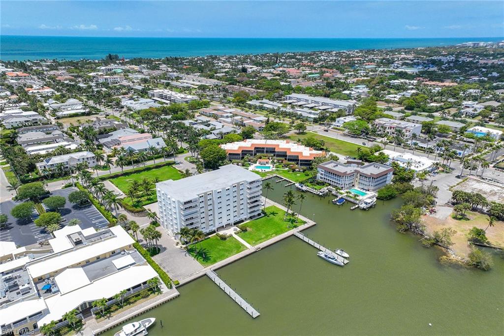 1325 7th Street South, Unit 2B Naples, FL 34102 - Photo 4 of 34 an aerial view of residential houses with outdoor space and swimming pool