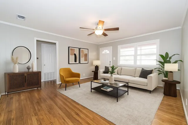 a living room with furniture a lamp and a window