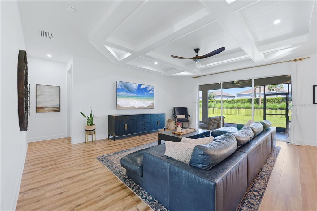 8498 Snowfall Street Sarasota, FL 34241 - Photo 28 of 95 a living room with furniture and a large window