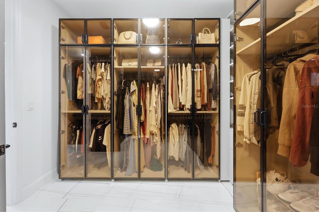 8498 Snowfall Street Sarasota, FL 34241 - Photo 40 of 95 a view of walk in closet with clothes and shoes