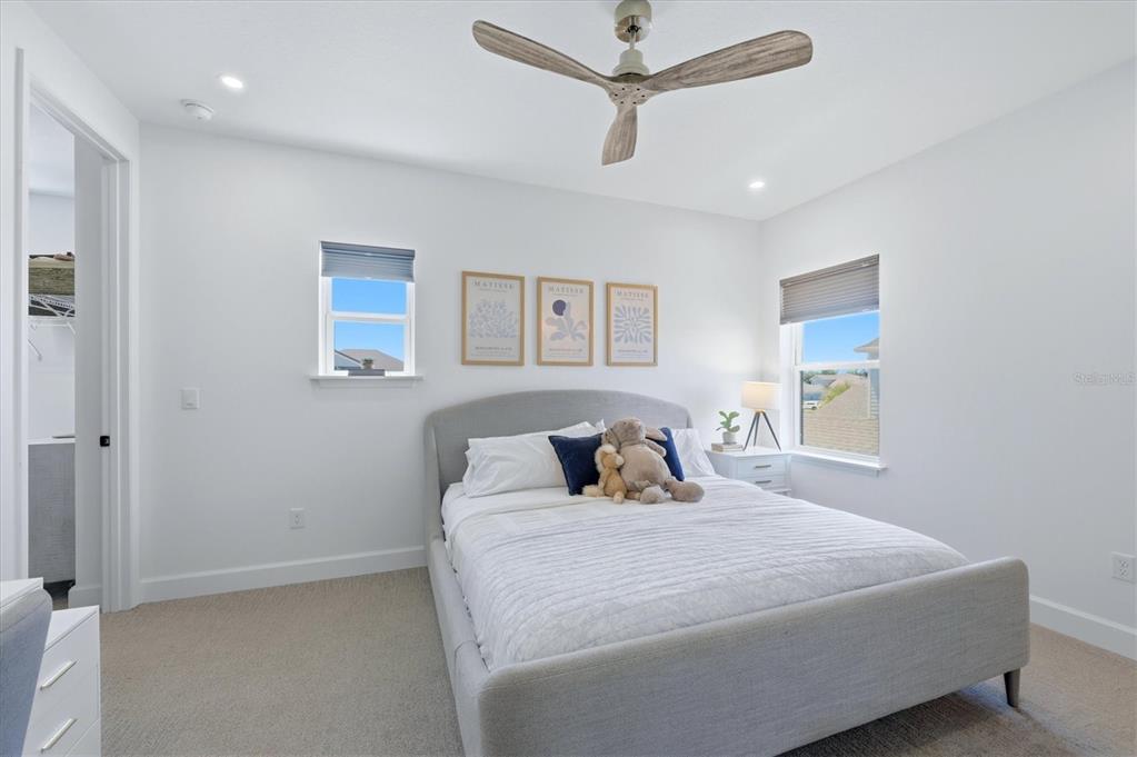 8498 Snowfall Street Sarasota, FL 34241 - Photo 50 of 95 a bedroom with a bed and a painting