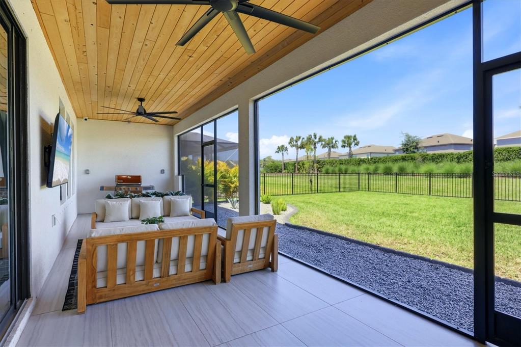8498 Snowfall Street Sarasota, FL 34241 - Photo 62 of 95 a bedroom with furniture and garden view
