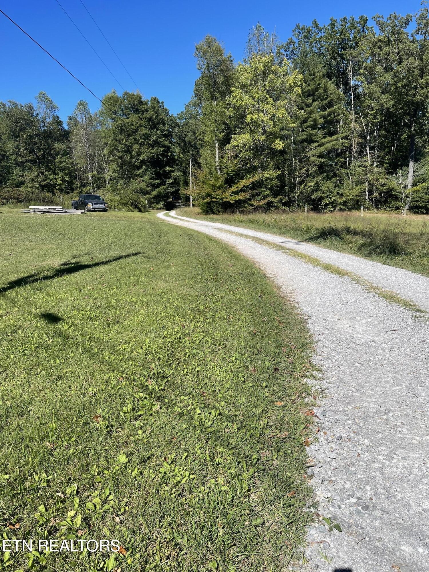 0 Charlie Newberry Road Lancing, TN 37770 - Photo 2 of 31 a view of a field with an trees