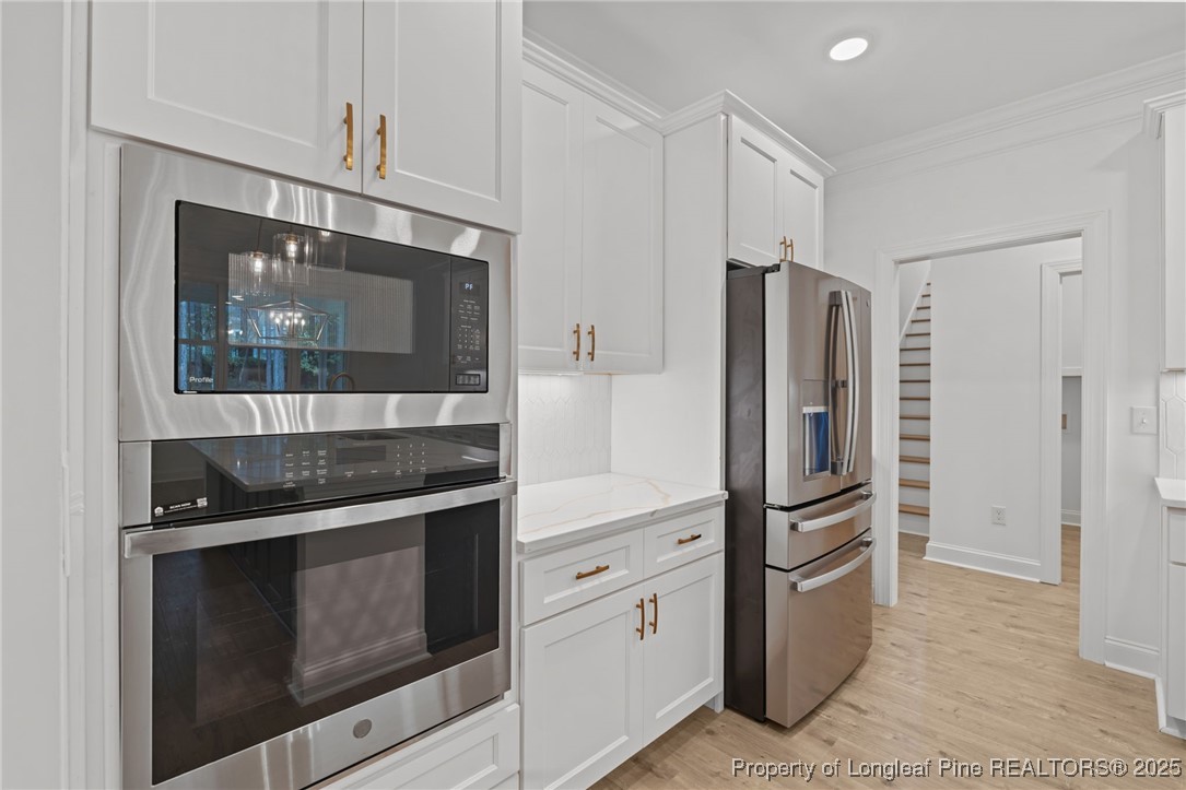 45 Pine Hill Court Spring Lake, NC 28390 - Photo 17 of 40 a kitchen with stainless steel appliances granite countertop a refrigerator and a stove top oven