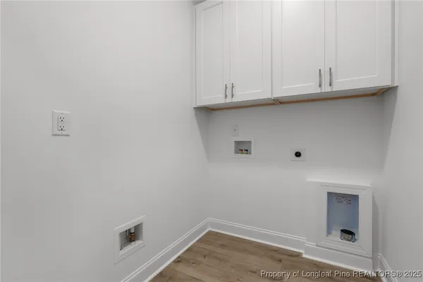 a bathroom with a toilet a sink and a mirror