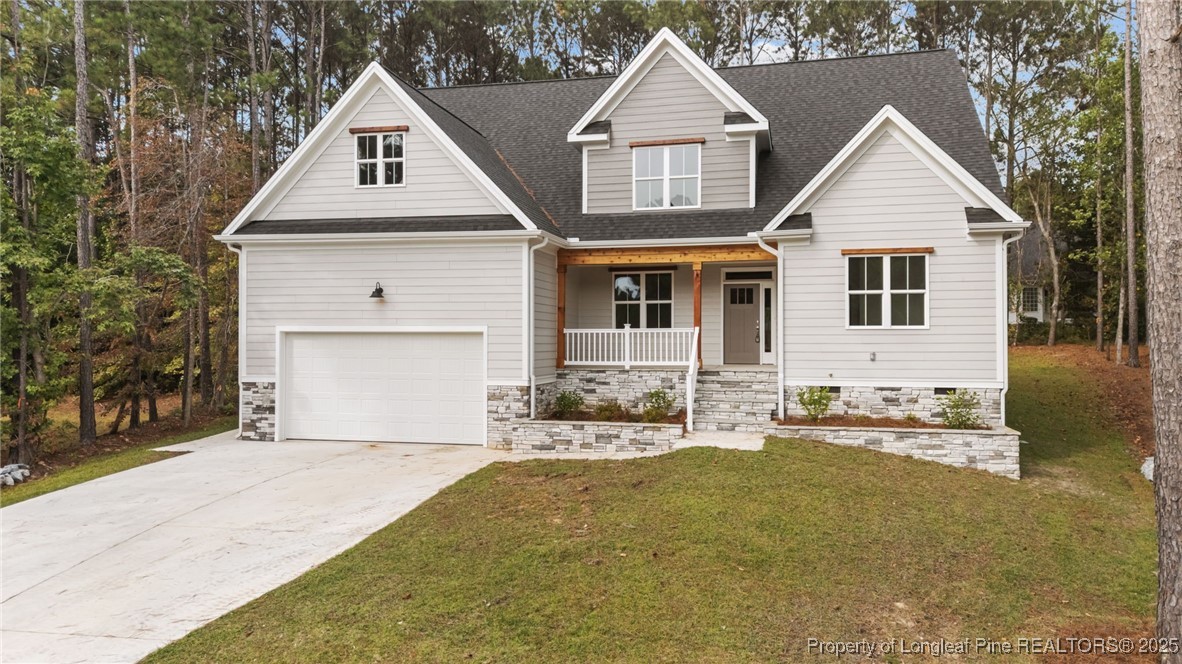 45 Pine Hill Court Spring Lake, NC 28390 - Photo 2 of 40 a front view of a house with yard