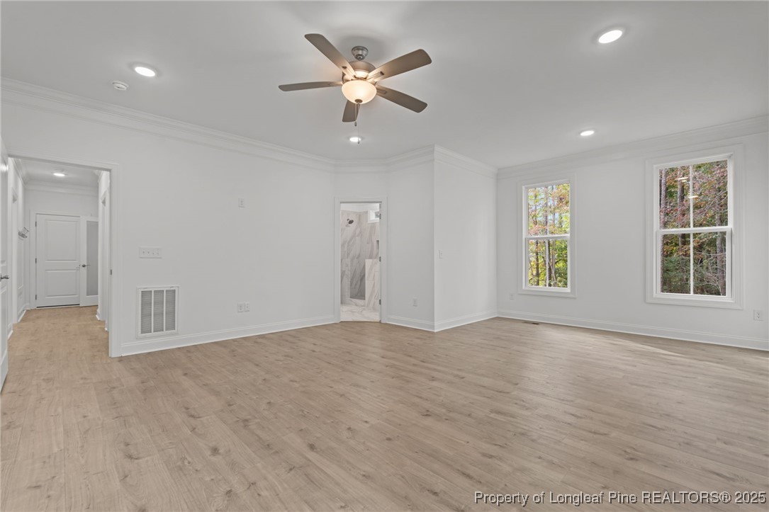 45 Pine Hill Court Spring Lake, NC 28390 - Photo 21 of 40 wooden floor in an empty room with a window