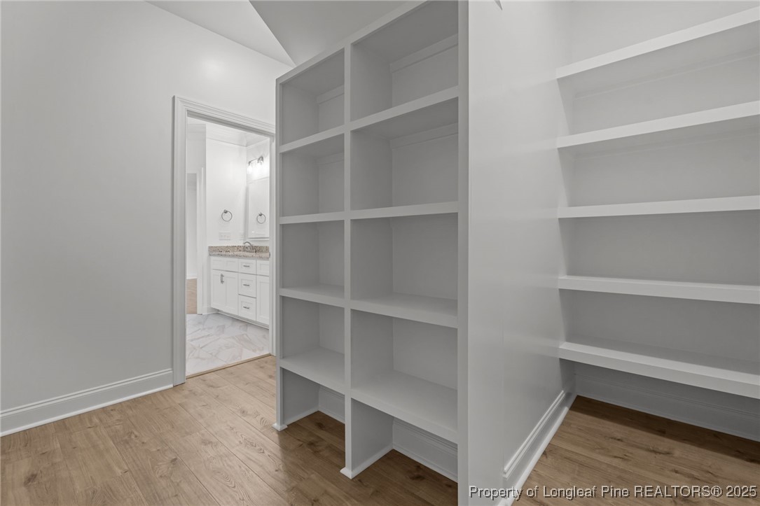 45 Pine Hill Court Spring Lake, NC 28390 - Photo 22 of 40 a view of an empty walk in closet